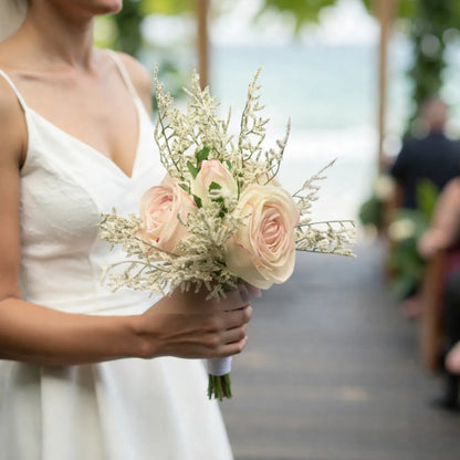 Bride holding a bouquet of flowers at an outdoor event