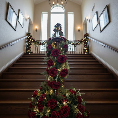 Decorative Christmas tree with red roses and lights on a staircase