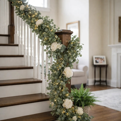 Decorative floral arrangement with lights on a staircase in a home setting