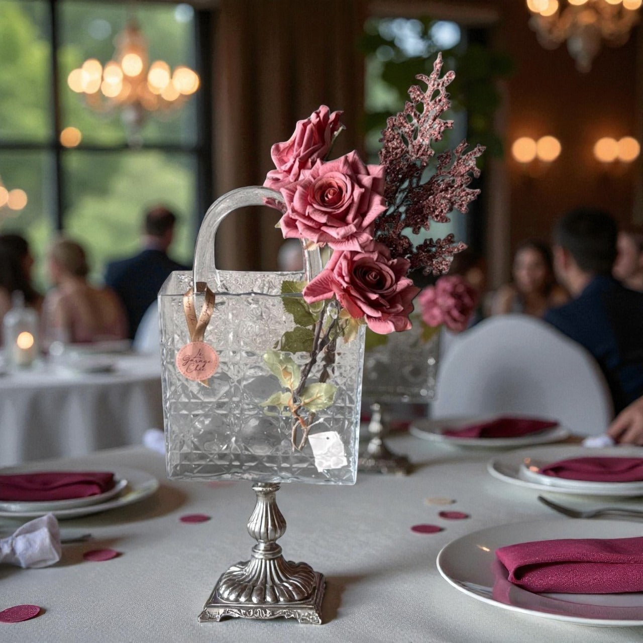 Decorative table setting with a crystal handbag and floral arrangement in a restaurant.
