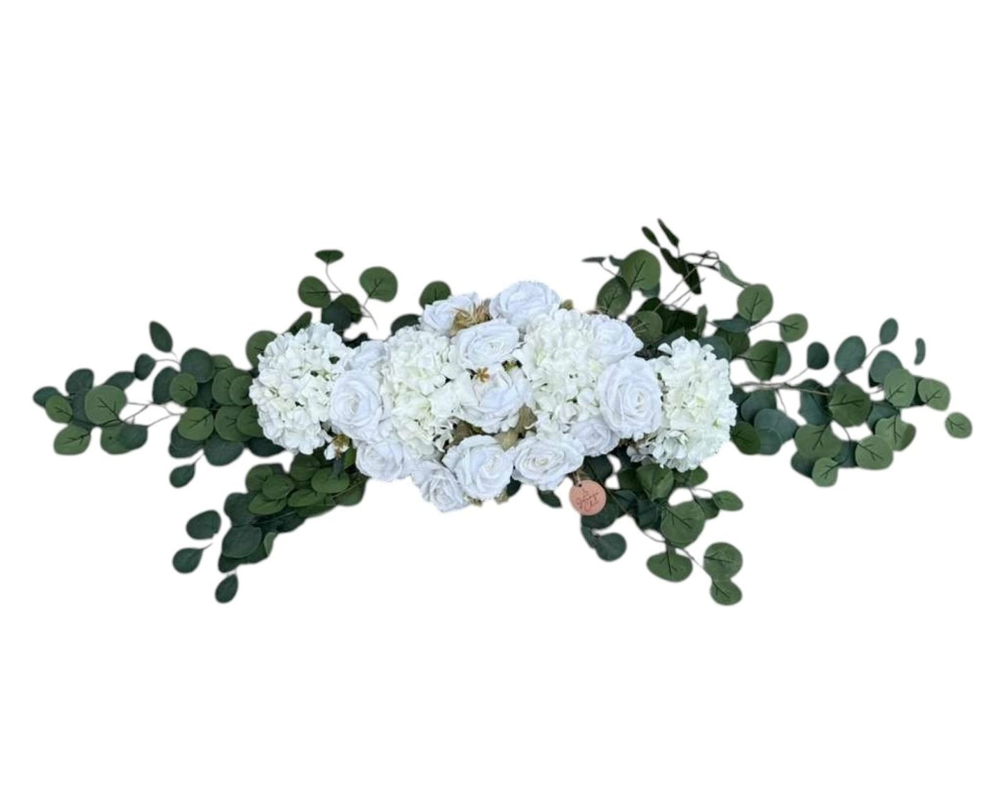 Floral arrangement with white flowers and green leaves on a white background