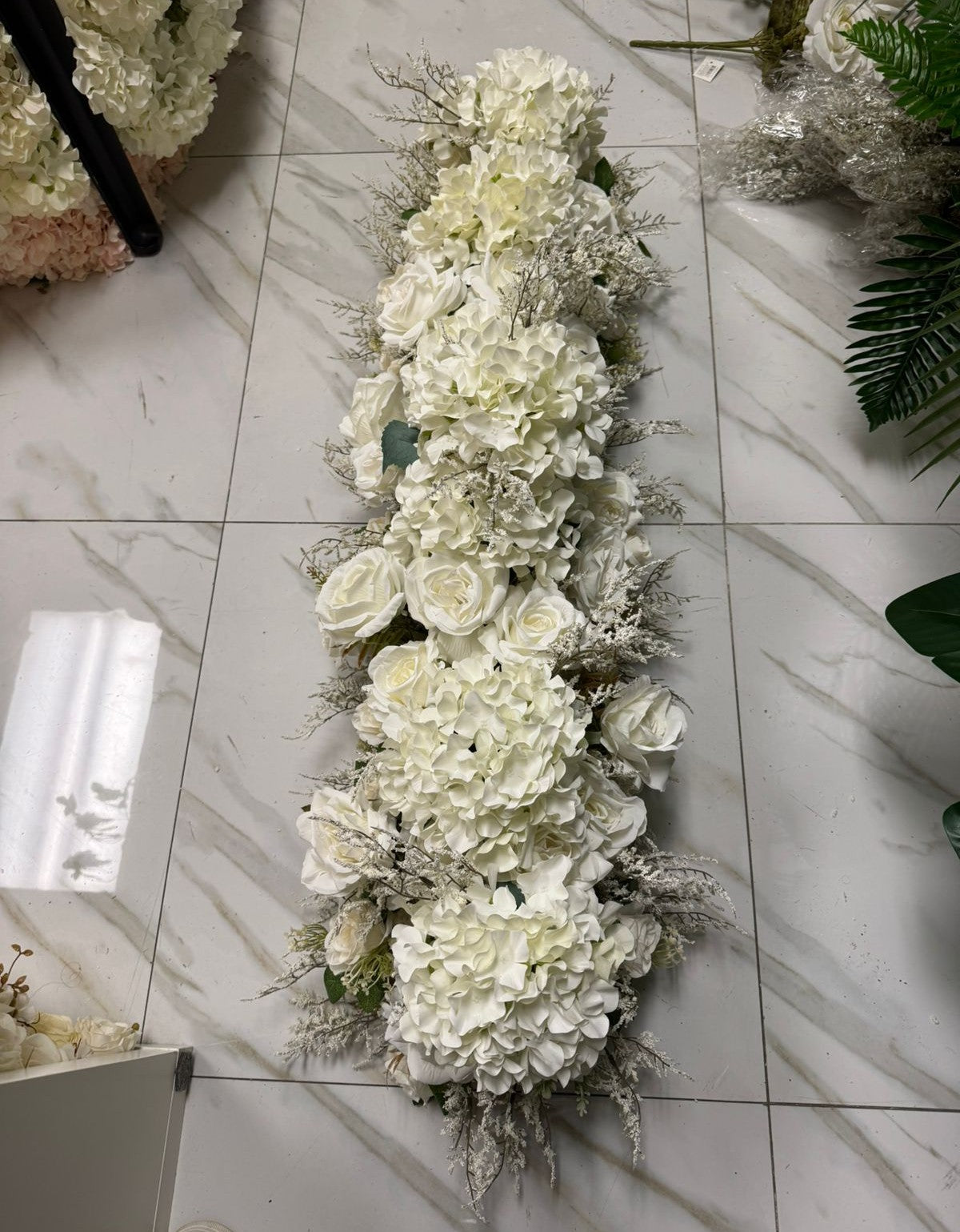 Floral arrangement on a marble floor