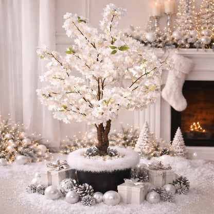 Decorative indoor scene with a white flowering tree, presents, and a fireplace.